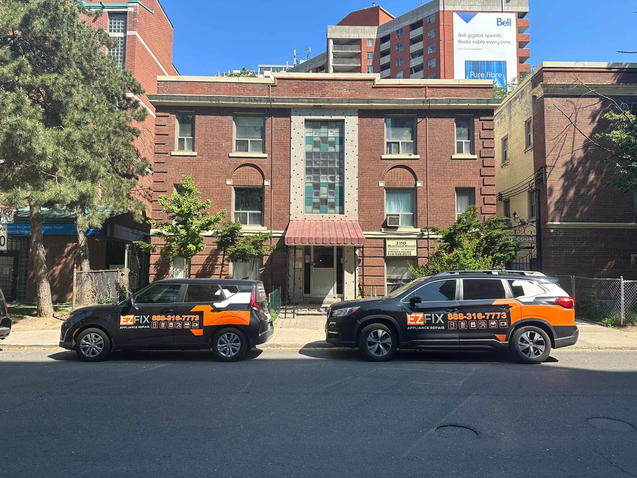 Real EZFIX service vehicles parked outside a local home